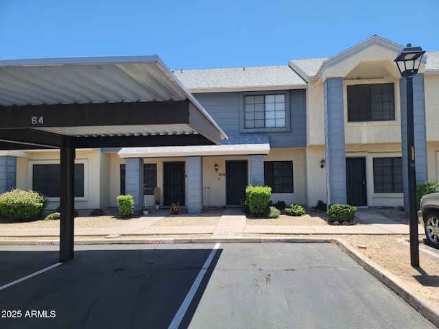 7801 N 44th Dr Unit 1036, Glendale, AZ 85301 - view of property featuring covered and uncovered parking