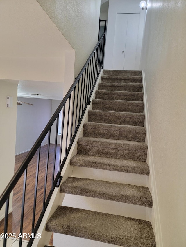 7801 N 44th Dr Unit 1036, Glendale, AZ 85301 - stairway featuring wood finished floors