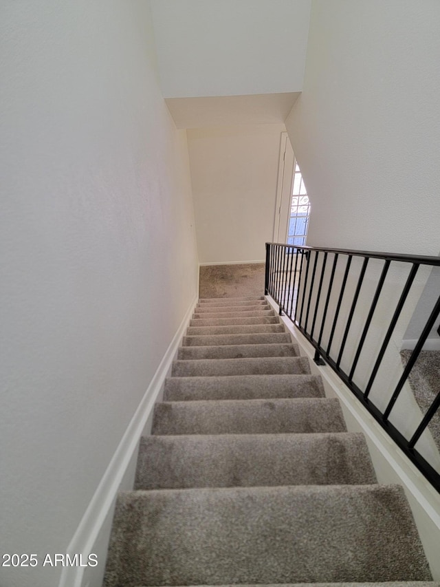 7801 N 44th Dr Unit 1036, Glendale, AZ 85301 - staircase featuring carpet flooring and a towering ceiling
