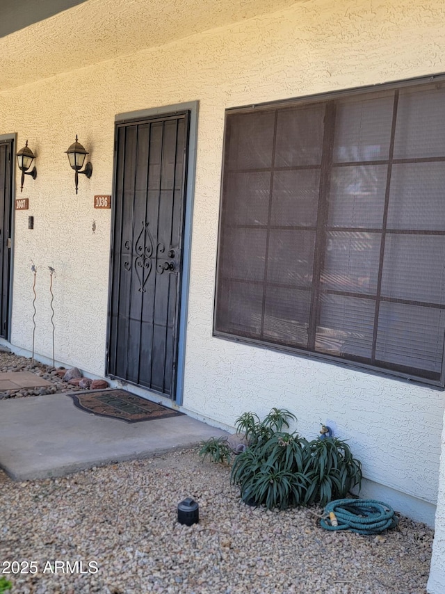 7801 N 44th Dr Unit 1036, Glendale, AZ 85301 - doorway to property with stucco siding