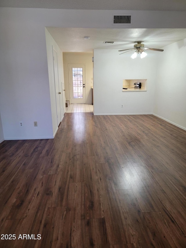 7801 N 44th Dr Unit 1036, Glendale, AZ 85301 - unfurnished living room with dark wood-type flooring and ceiling fan
