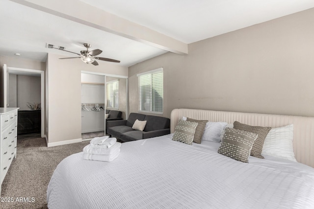 bedroom with carpet floors, beam ceiling, a closet, visible vents, and baseboards