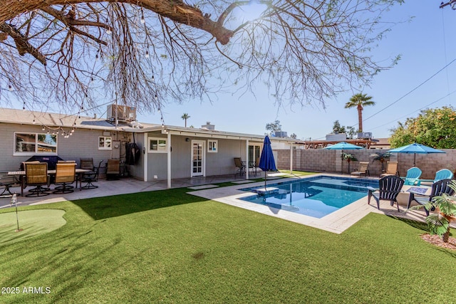 back of house with a yard, a fenced in pool, a fenced backyard, and a patio