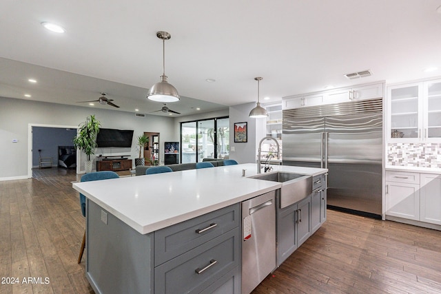 kitchen with ceiling fan, white cabinets, appliances with stainless steel finishes, and gray cabinetry