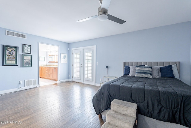 bedroom with ceiling fan, connected bathroom, and hardwood / wood-style floors