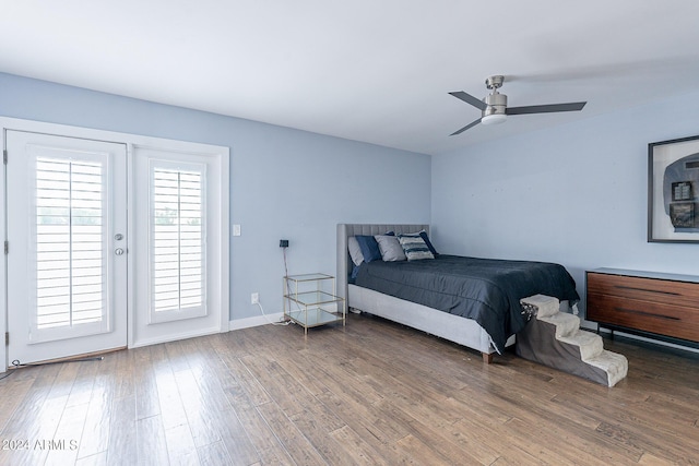 bedroom featuring ceiling fan, hardwood / wood-style flooring, and access to outside