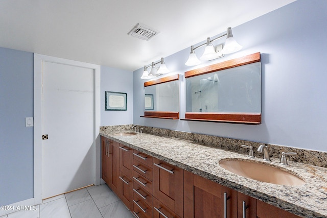 bathroom featuring vanity and tile patterned flooring