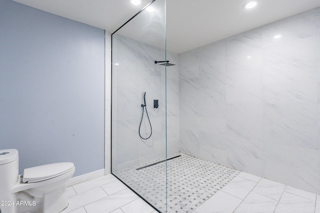 bathroom featuring toilet and tiled shower