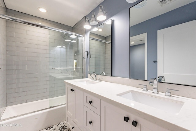 bathroom with enclosed tub / shower combo and vanity