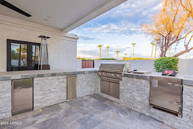 view of patio featuring grilling area, area for grilling, and french doors