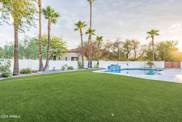 view of yard with a patio area and a fenced in pool