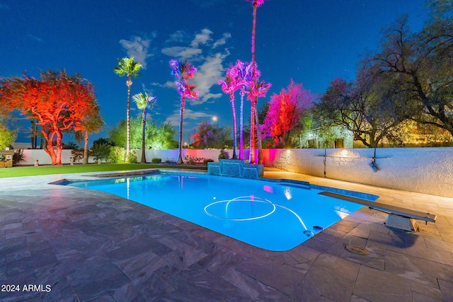 pool at twilight with a diving board