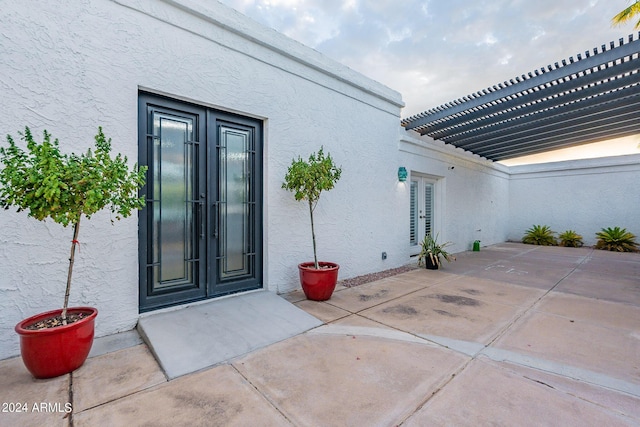 doorway to property featuring french doors and a patio