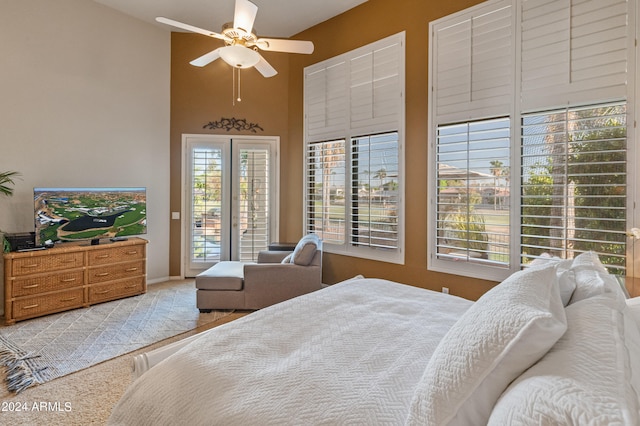 bedroom with access to outside and ceiling fan