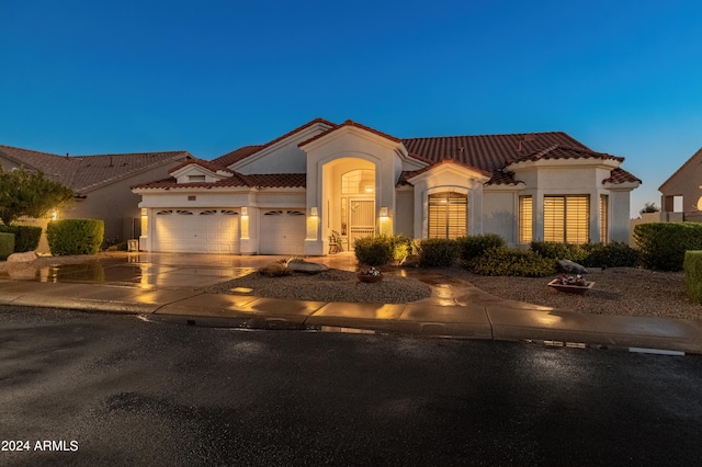 mediterranean / spanish-style house featuring a garage