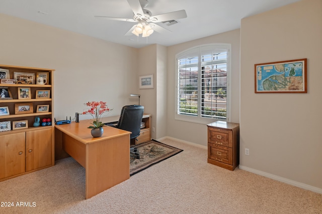 office space featuring light colored carpet and ceiling fan