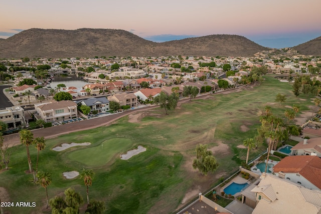 aerial view at dusk with a water and mountain view