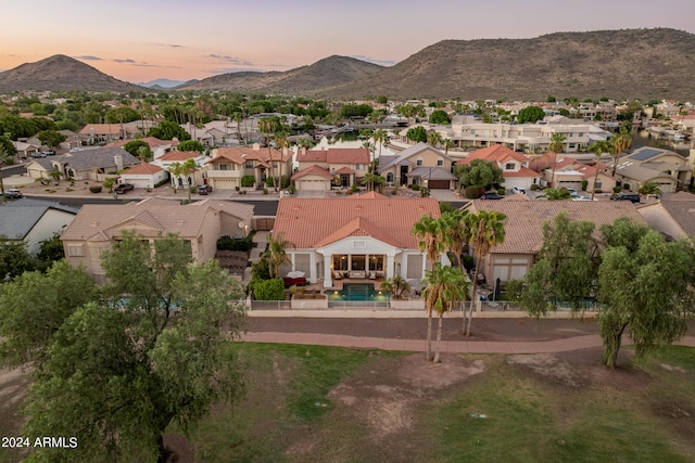 aerial view at dusk with a mountain view