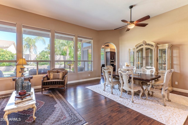 dining space featuring ceiling fan and dark hardwood / wood-style flooring