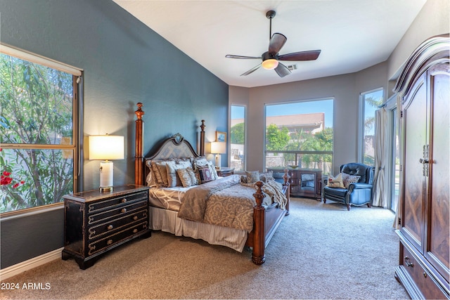 bedroom featuring carpet, multiple windows, and ceiling fan