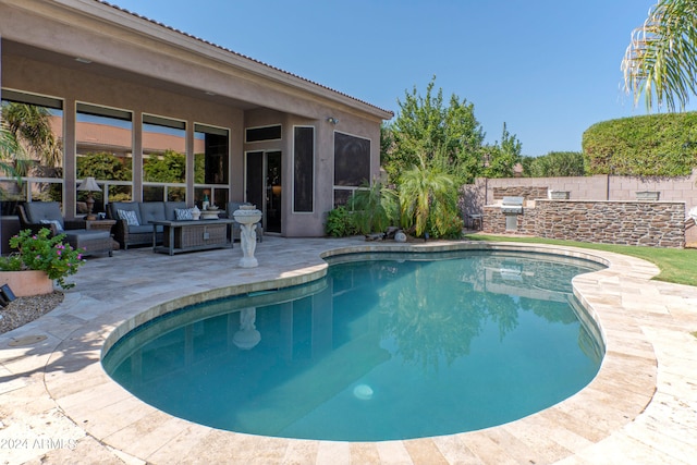 view of swimming pool featuring an outdoor living space and a patio