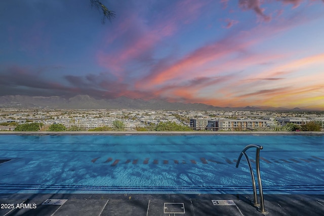 view of pool with a mountain view