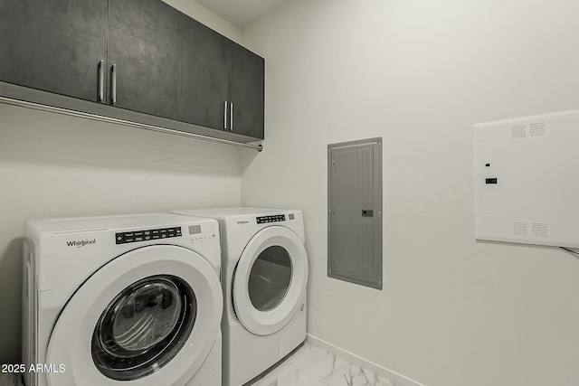 laundry area featuring marble finish floor, electric panel, cabinet space, baseboards, and washing machine and clothes dryer