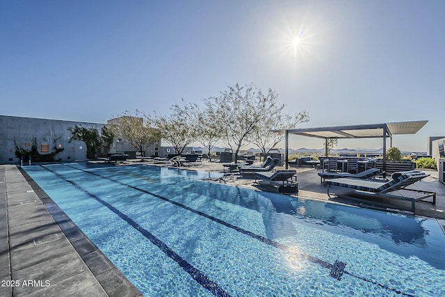 view of swimming pool with a patio area