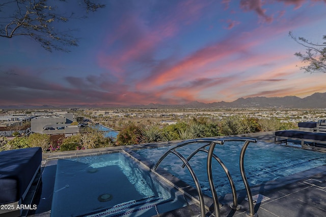 view of swimming pool featuring a mountain view