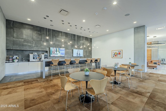 dining area featuring visible vents and recessed lighting