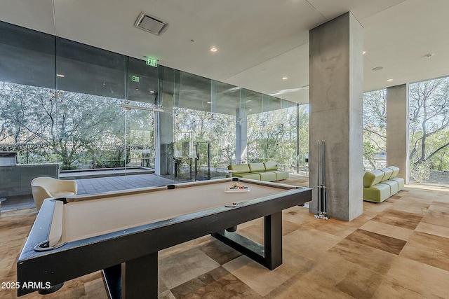 playroom with visible vents, pool table, and floor to ceiling windows