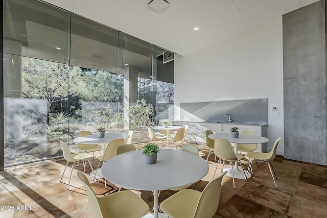 interior space with a sink, outdoor dining area, and visible vents