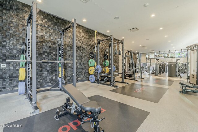 workout area featuring visible vents and recessed lighting