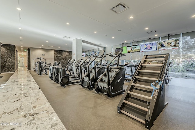 exercise room with recessed lighting, visible vents, and floor to ceiling windows