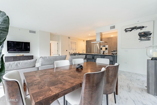 dining area with visible vents and marble finish floor