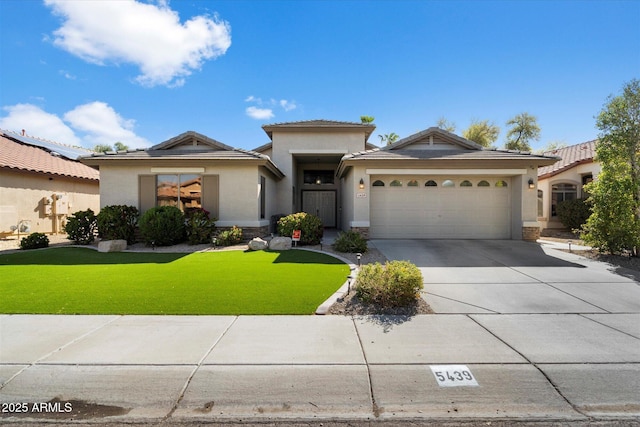 view of front facade featuring concrete driveway, a garage, a front lawn, and stucco siding