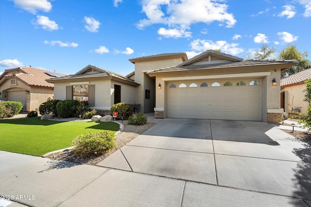 view of front of property with stucco siding, a front lawn, stone siding, concrete driveway, and an attached garage