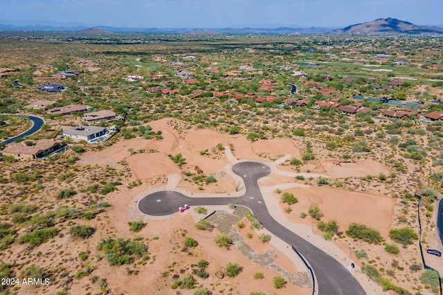 birds eye view of property featuring a mountain view