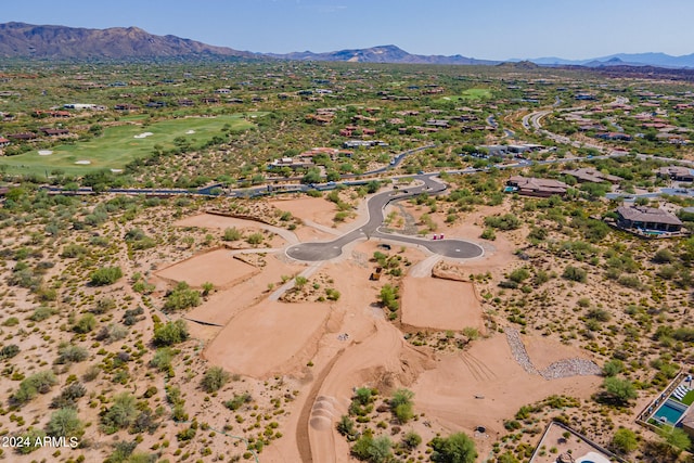 birds eye view of property with a mountain view