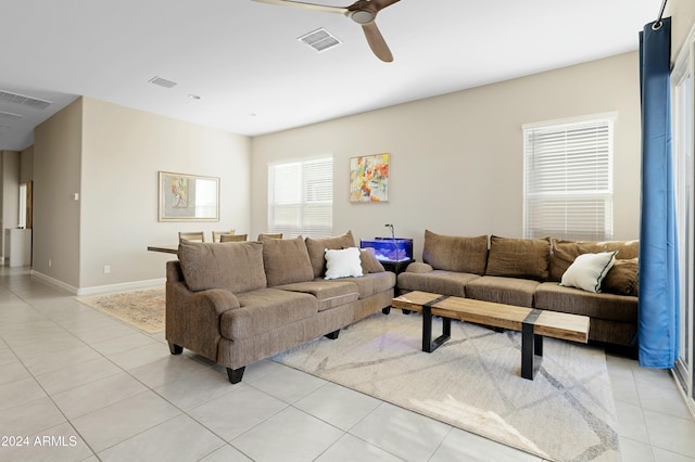 living room featuring ceiling fan and light tile patterned flooring