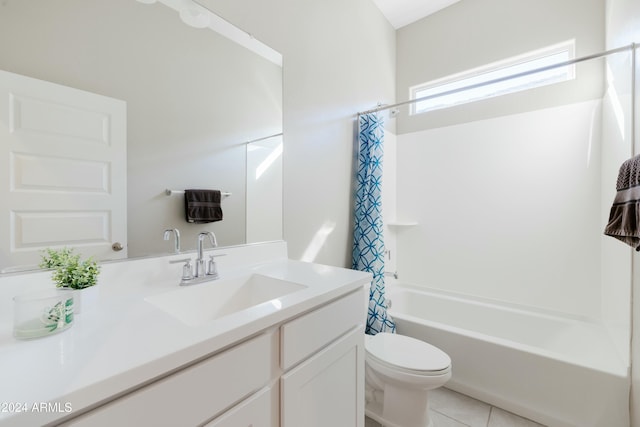 full bathroom featuring toilet, vanity, tile patterned floors, and shower / bath combo with shower curtain