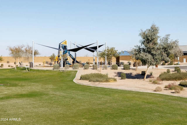 view of property's community with a lawn