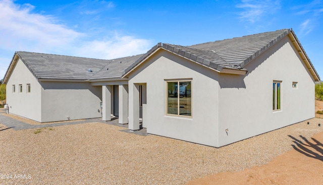 back of property featuring a patio area