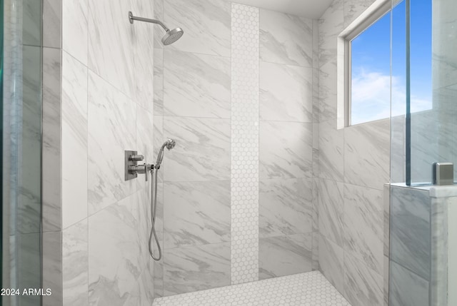 bathroom with tiled shower