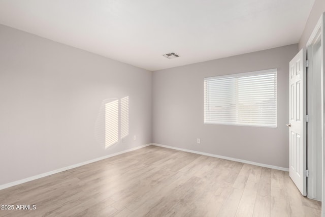 unfurnished room featuring light wood-type flooring