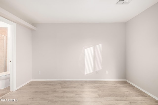 unfurnished room featuring light hardwood / wood-style flooring