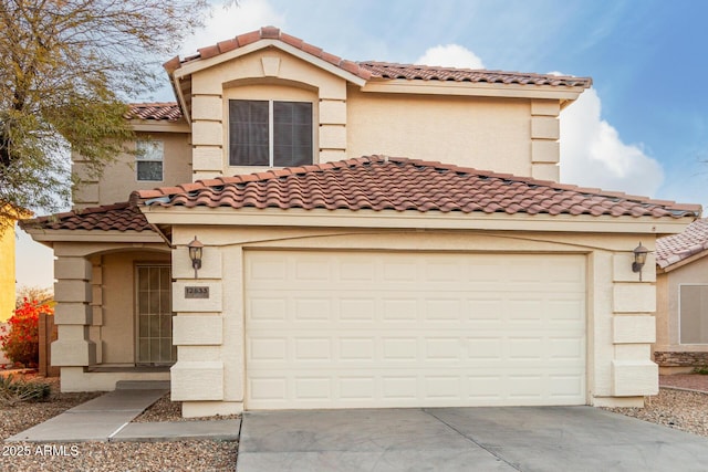 mediterranean / spanish-style house with a garage