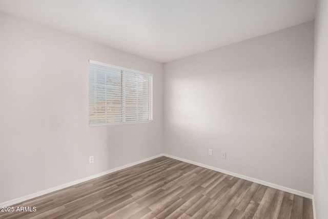 unfurnished room featuring hardwood / wood-style floors