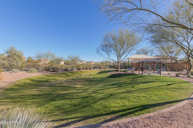 surrounding community featuring a gazebo and a yard