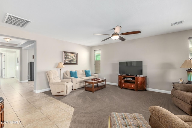 living room with light tile patterned floors and ceiling fan